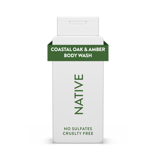 Native Coastal Oak & Amber Body Wash bottle with white packaging and green text