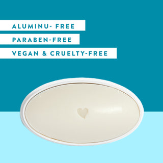 Inside of Native Ocean & Timber deodorant laid flat on blue background