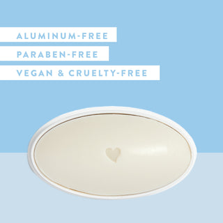 Inside of Native Powder & Cotton deodorant laid flat on blue background