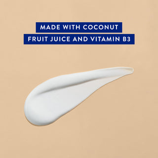 Cream swatch on beige background with text: Made with coconut fruit juice and vitamin b3